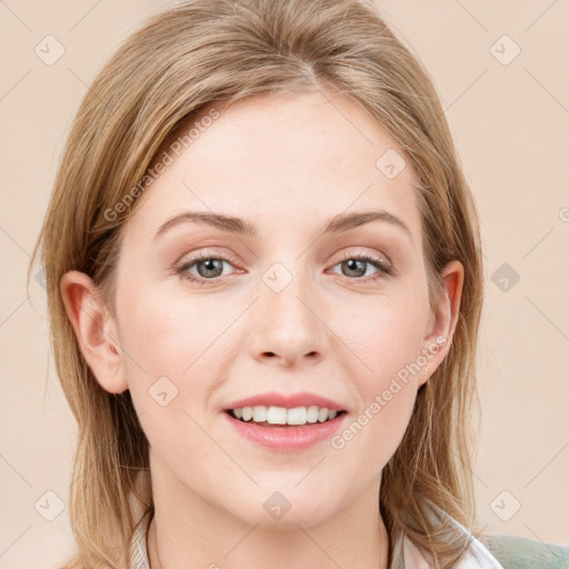 Joyful white young-adult female with medium  brown hair and blue eyes