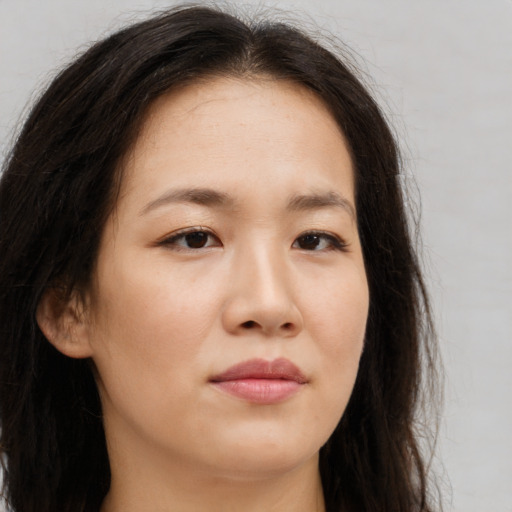 Neutral asian young-adult female with long  brown hair and brown eyes