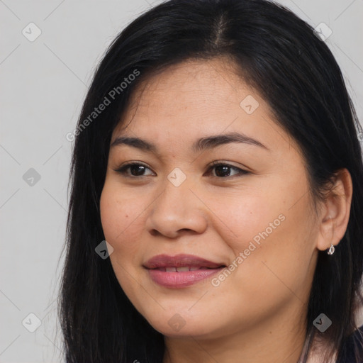 Joyful latino young-adult female with long  brown hair and brown eyes