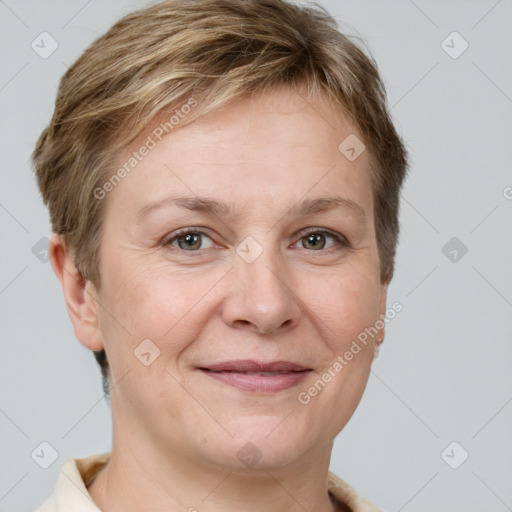 Joyful white adult female with short  brown hair and grey eyes