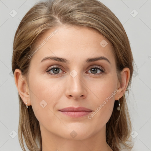 Joyful white young-adult female with medium  brown hair and grey eyes