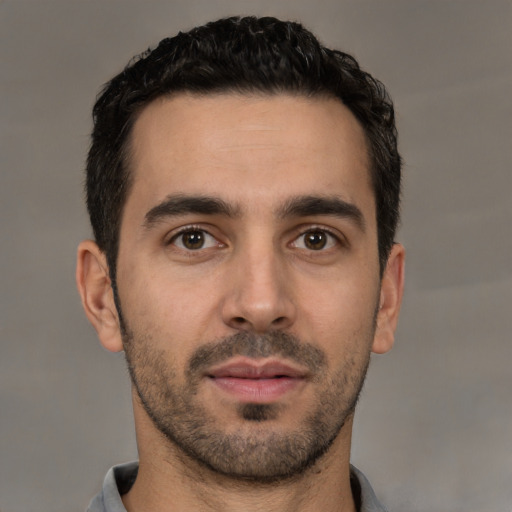 Neutral white young-adult male with short  black hair and brown eyes
