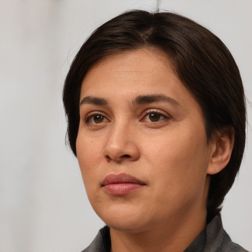 Neutral white young-adult female with short  brown hair and brown eyes