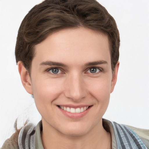 Joyful white young-adult female with short  brown hair and grey eyes