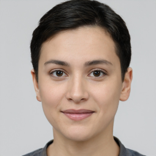 Joyful white young-adult female with short  black hair and brown eyes