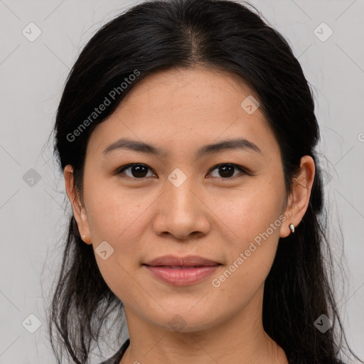 Joyful asian young-adult female with long  brown hair and brown eyes