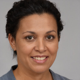 Joyful white adult female with short  brown hair and brown eyes