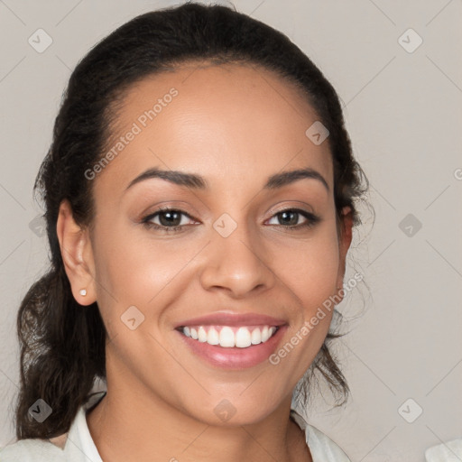 Joyful latino young-adult female with medium  brown hair and brown eyes