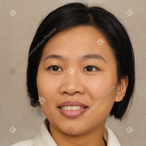 Joyful asian young-adult female with medium  black hair and brown eyes