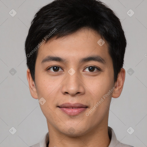 Joyful asian young-adult male with short  black hair and brown eyes