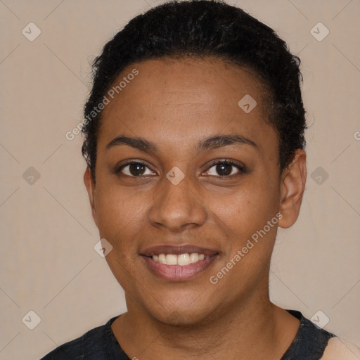 Joyful black young-adult female with short  black hair and brown eyes