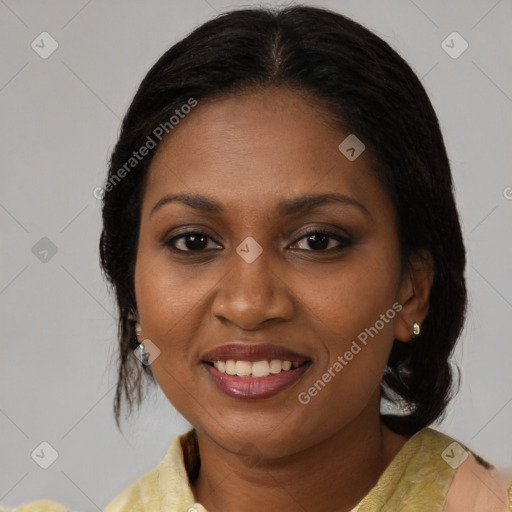 Joyful black adult female with medium  brown hair and brown eyes