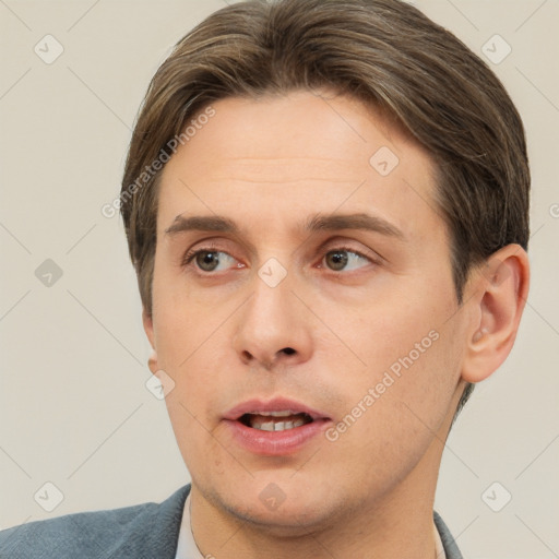 Neutral white young-adult male with short  brown hair and brown eyes