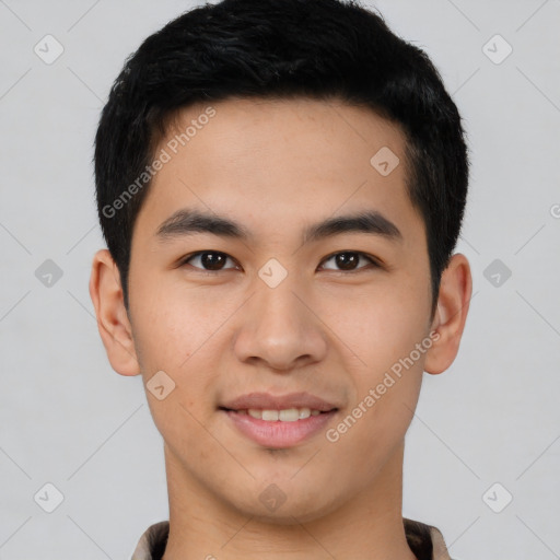 Joyful asian young-adult male with short  brown hair and brown eyes