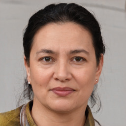 Joyful white adult female with medium  brown hair and brown eyes