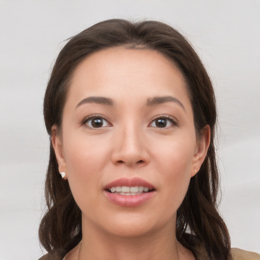 Joyful white young-adult female with medium  brown hair and brown eyes