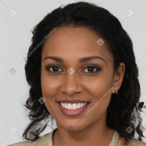 Joyful black young-adult female with long  brown hair and brown eyes