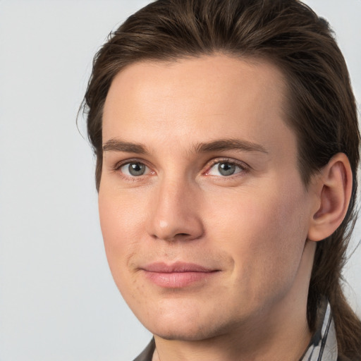 Joyful white young-adult male with medium  brown hair and brown eyes