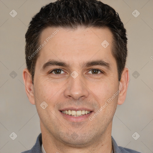 Joyful white adult male with short  brown hair and brown eyes