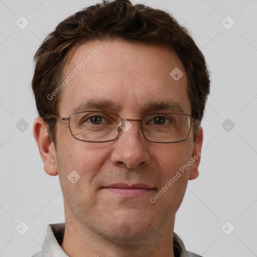 Joyful white adult male with short  brown hair and grey eyes