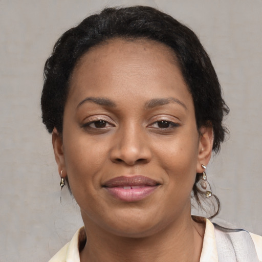 Joyful black young-adult female with medium  brown hair and brown eyes