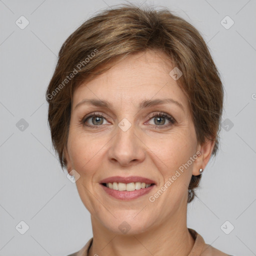 Joyful white adult female with medium  brown hair and grey eyes