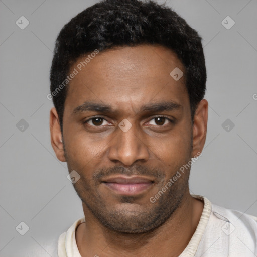 Joyful black young-adult male with short  black hair and brown eyes