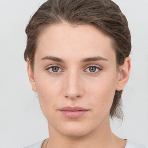 Neutral white young-adult female with medium  brown hair and brown eyes