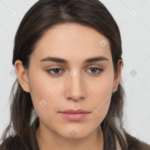 Neutral white young-adult female with long  brown hair and brown eyes