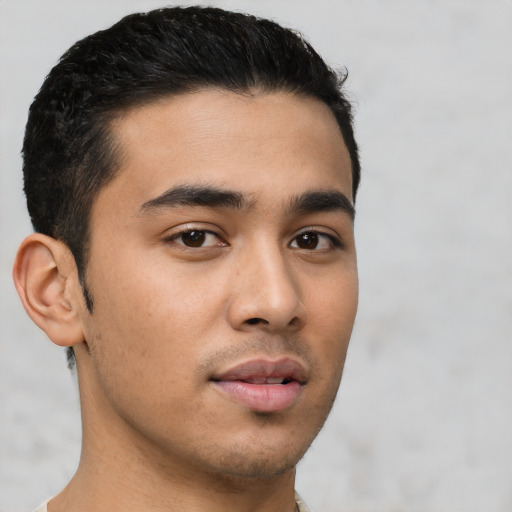 Neutral latino young-adult male with short  black hair and brown eyes