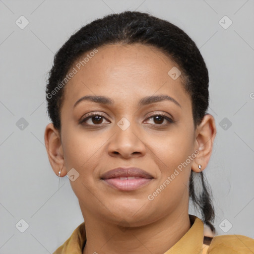 Joyful black young-adult female with short  brown hair and brown eyes