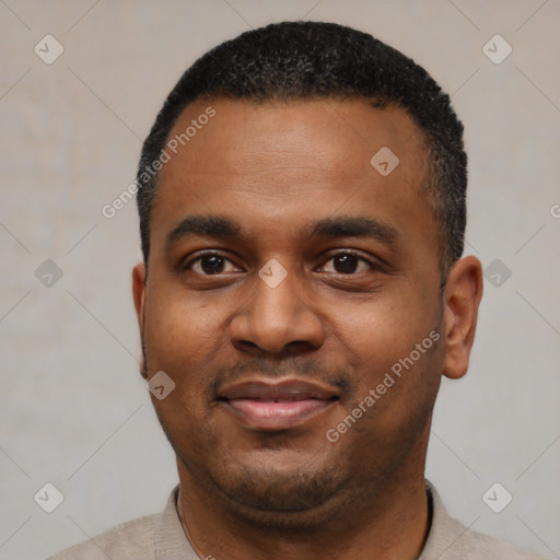 Joyful black young-adult male with short  black hair and brown eyes