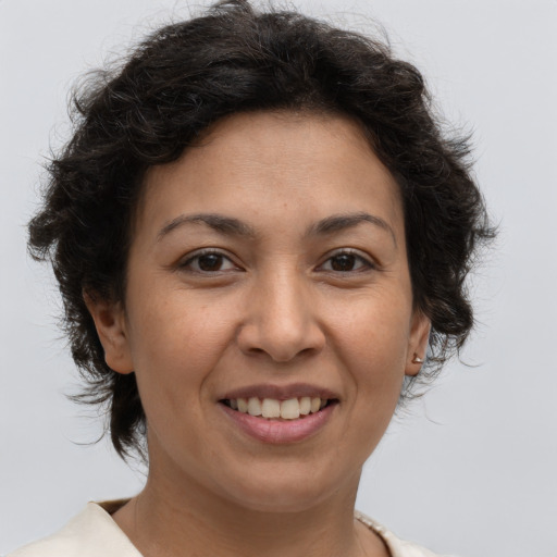 Joyful white adult female with short  brown hair and brown eyes