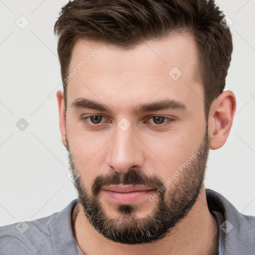 Neutral white young-adult male with short  brown hair and brown eyes