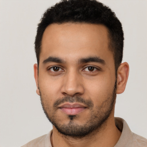 Neutral latino young-adult male with short  black hair and brown eyes