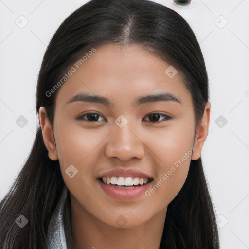 Joyful latino young-adult female with long  brown hair and brown eyes