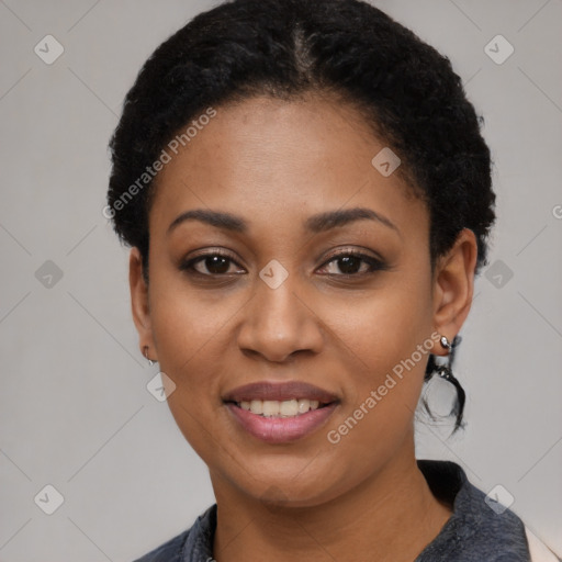 Joyful black young-adult female with short  black hair and brown eyes