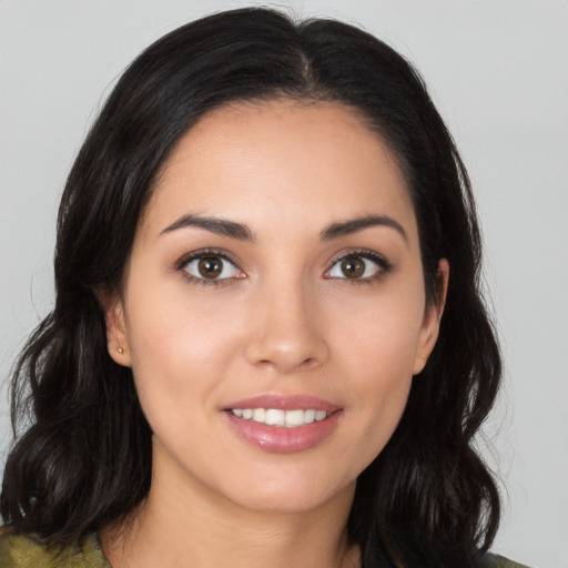 Joyful white young-adult female with long  black hair and brown eyes