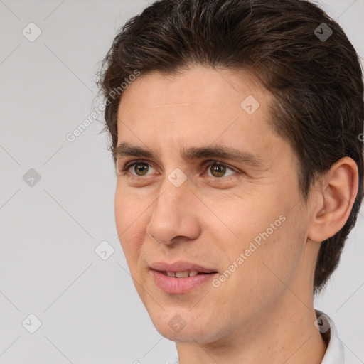 Joyful white adult male with short  brown hair and brown eyes