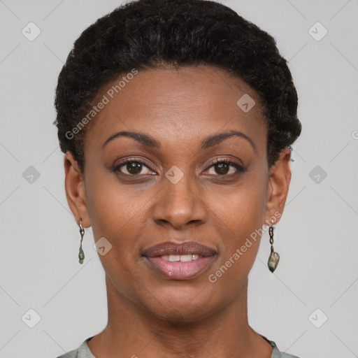 Joyful black young-adult female with short  black hair and brown eyes