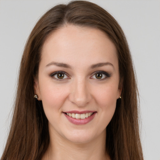 Joyful white young-adult female with long  brown hair and grey eyes