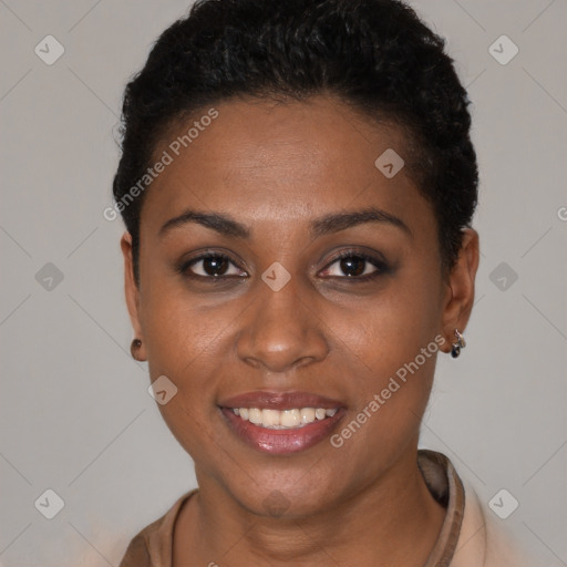 Joyful black young-adult female with short  black hair and brown eyes