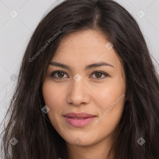 Joyful latino young-adult female with long  brown hair and brown eyes