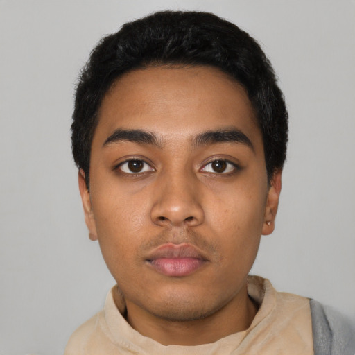 Neutral latino young-adult male with short  black hair and brown eyes