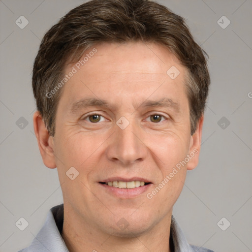 Joyful white adult male with short  brown hair and brown eyes