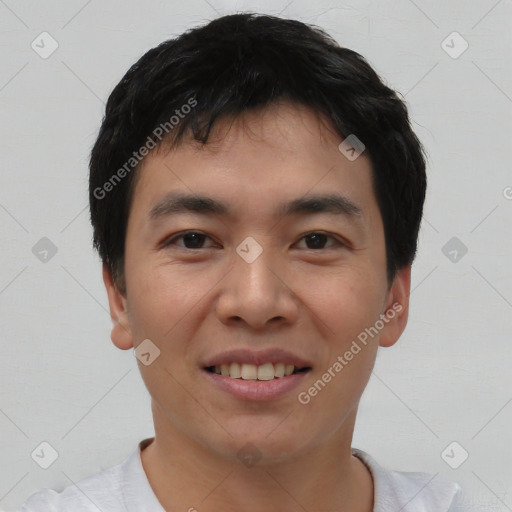 Joyful asian young-adult male with short  black hair and brown eyes