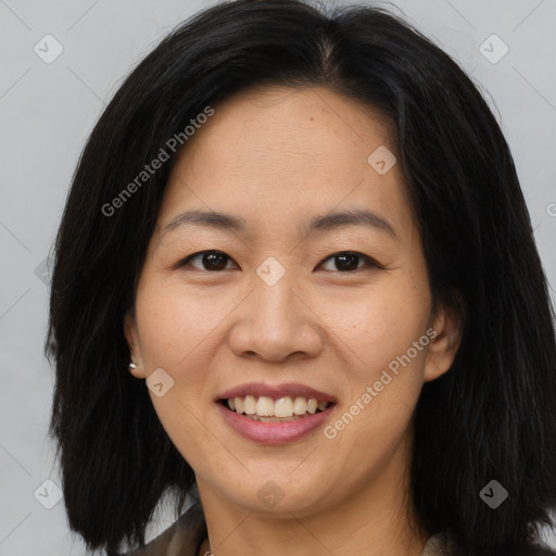 Joyful asian young-adult female with long  brown hair and brown eyes