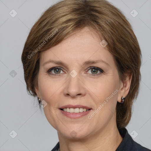 Joyful white adult female with medium  brown hair and grey eyes