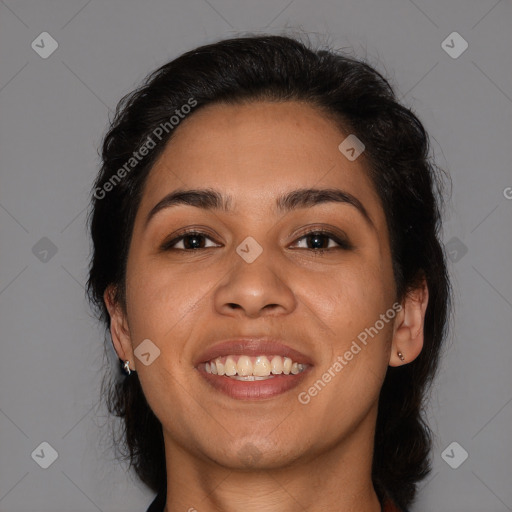 Joyful latino young-adult female with medium  brown hair and brown eyes