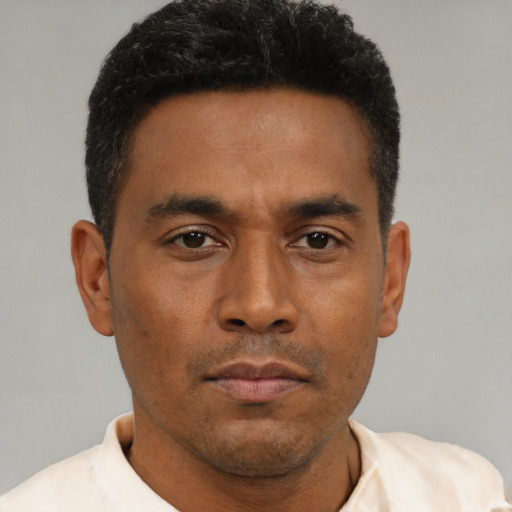Neutral black young-adult male with short  brown hair and brown eyes